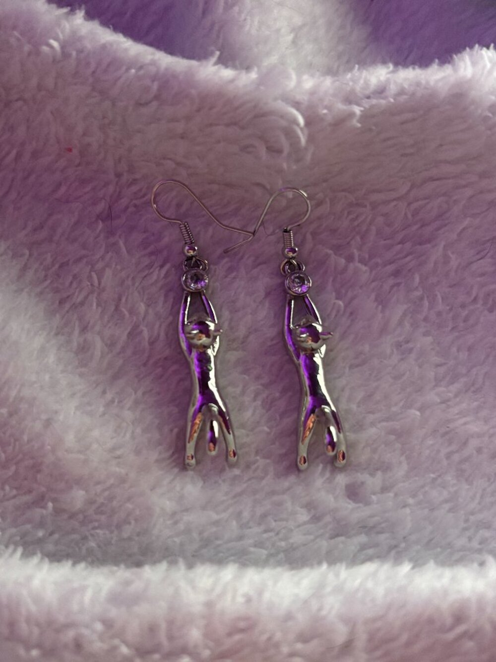 Novelty cat earrings, metallic silver color, women's one size.